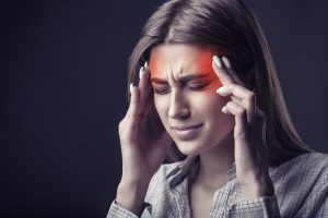 a women feeling headache