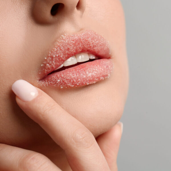 a woman lips with lip exfoliator on them