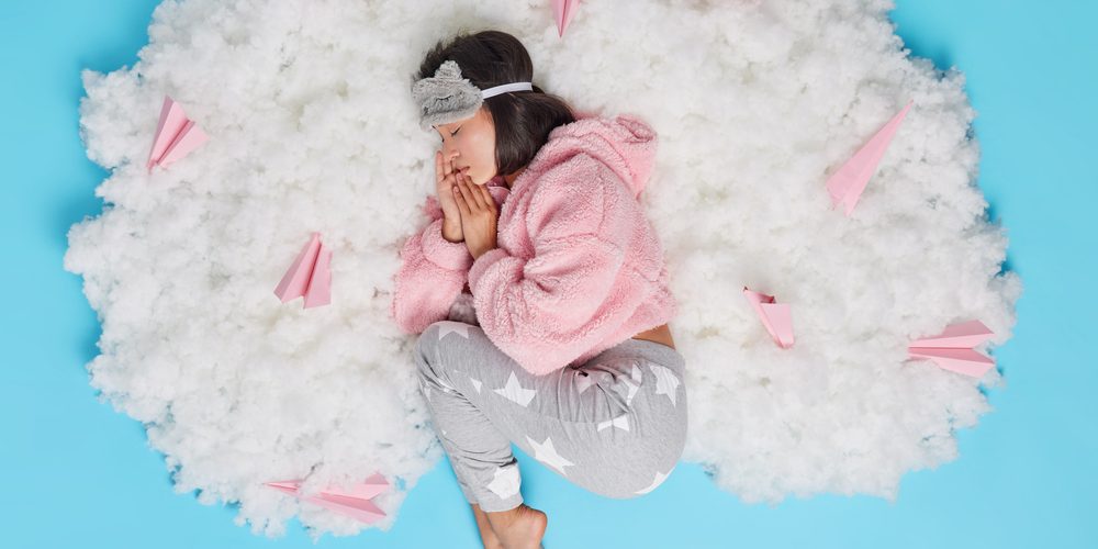 a woman sleeping on cotton