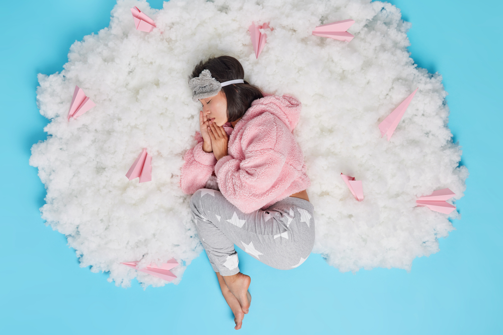 a woman sleeping on cotton