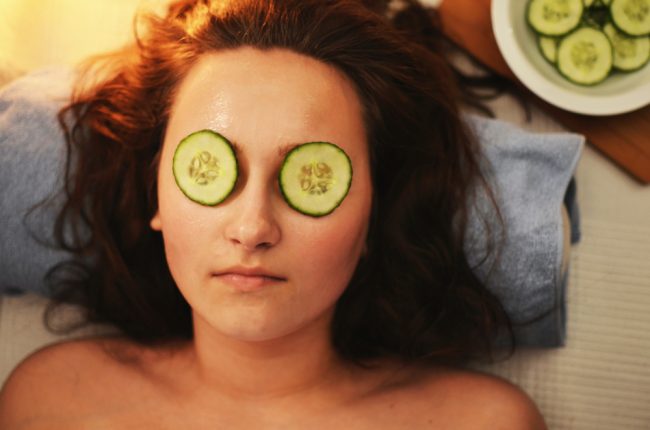 pexels-breakingpic-3192 a woman with cucumber slices on eyes